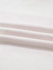 White knit sweater with a textured fabric detail