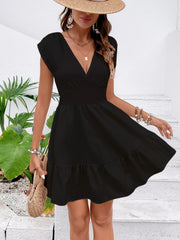 Black cap sleeve mini dress with tiered ruffle hem and deep V-neckline.