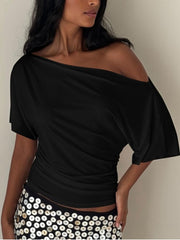 Black ruched one shoulder t-shirt with short sleeves and asymmetrical neckline.