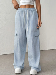 Light blue pleated cargo palazzo trousers with drawstring waist and side pockets.