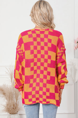 Checkerboard knit open cardigan in orange and pink acrylic with a relaxed fit.