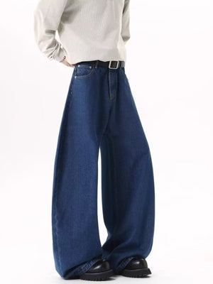 Men's dark blue wide leg jeans with belt loops and contrast stitching.