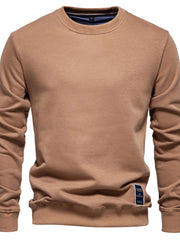Camel crewneck sweatshirt with subtle patch detail on the hem