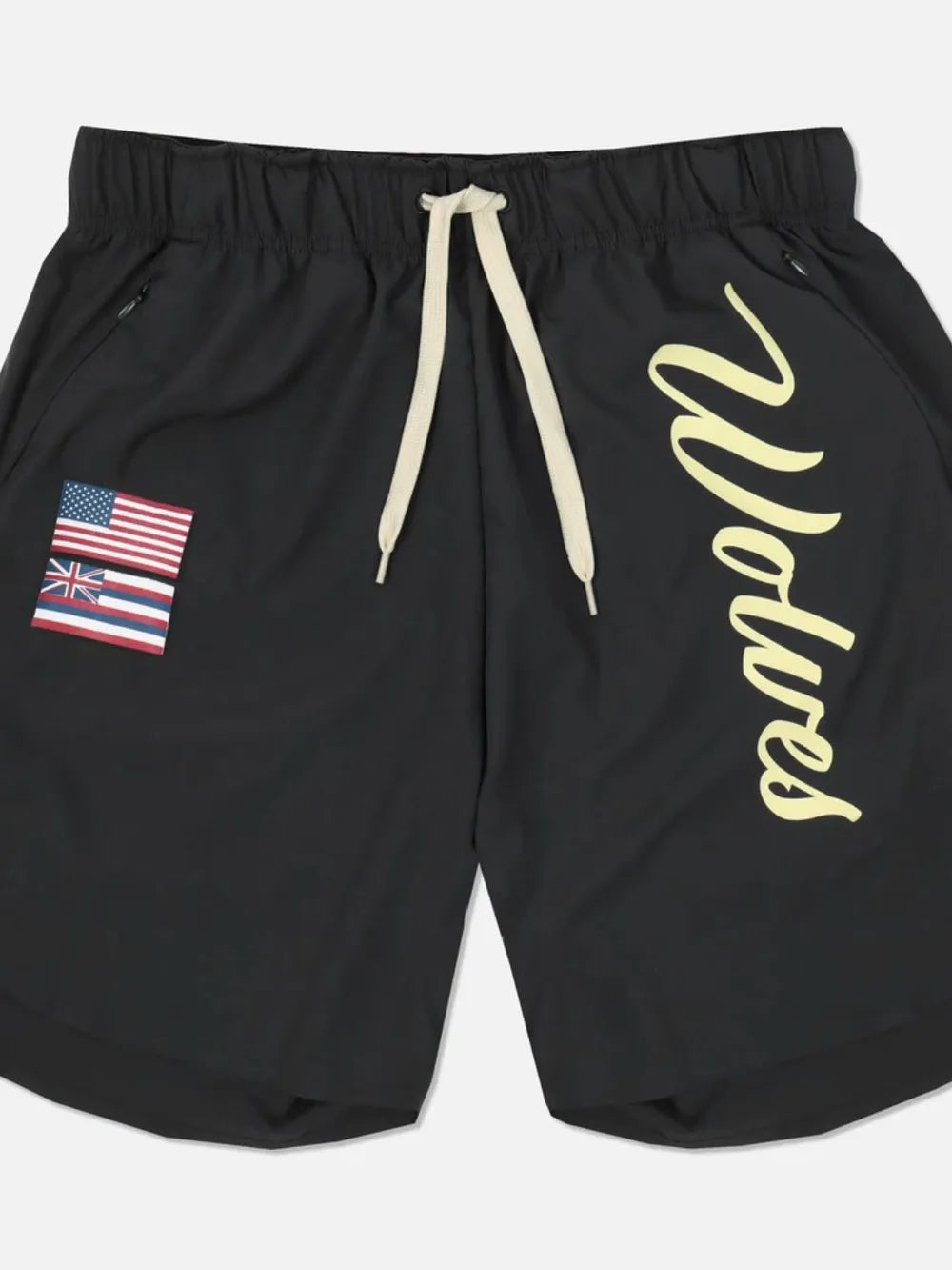 Black active shorts with drawstring, flag patch, and script logo detail.