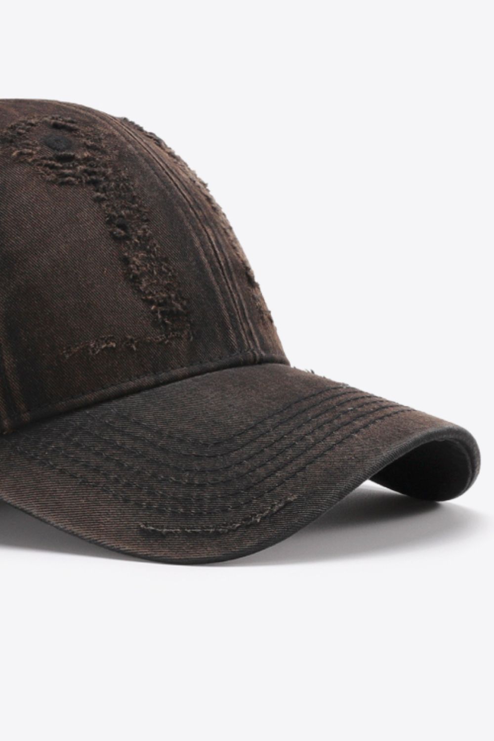 Baseball cap in Chestnut with distressed details and stitched brim.