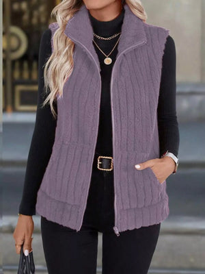 Purple fleece zip-up vest with pockets and a stand-up collar.