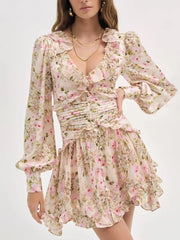 Charming floral mini dress with ruffled V-neck, ruched waist, and balloon sleeves.