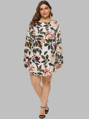 Botanical print trapeze mini dress in ivory with long sleeves and a round neckline.
