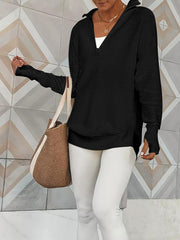 Black ribbed knit pullover with funnel neck and quarter zip, long sleeves with thumbholes.