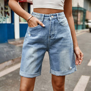Rolled hem boyfriend denim shorts in medium wash with distressed details and a button fly.
