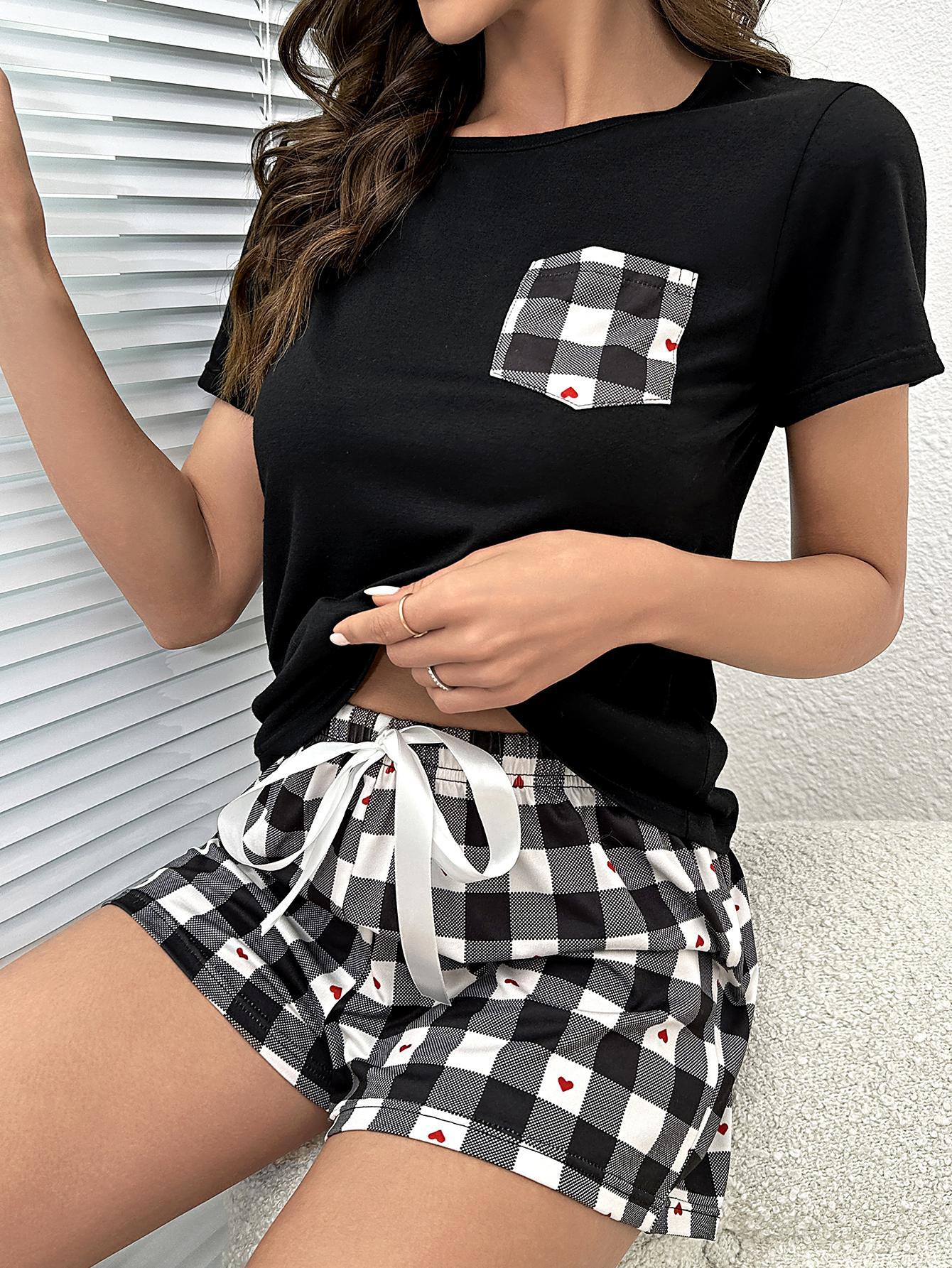 Black loungewear set with gingham pattern shorts and a pocket tee featuring a gingham heart pocket.