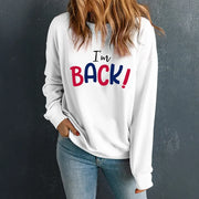 White crewneck sweatshirt with I'm Back! graphic in red and blue text