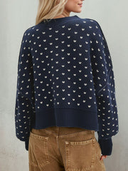 Dotted knit cropped crewneck sweater in dark blue with white pattern, crewneck, long sleeves.