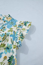 Cotton floral mini dress with V-neck and ruffled sleeves in blue and green.