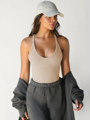 Tan ribbed racerback tank top with deep scoop neckline.