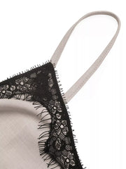 Luxe cami top in light grey with black lace trim and adjustable strap detail.