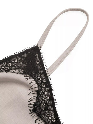 Luxe cami top in light grey with black lace trim and adjustable strap detail.