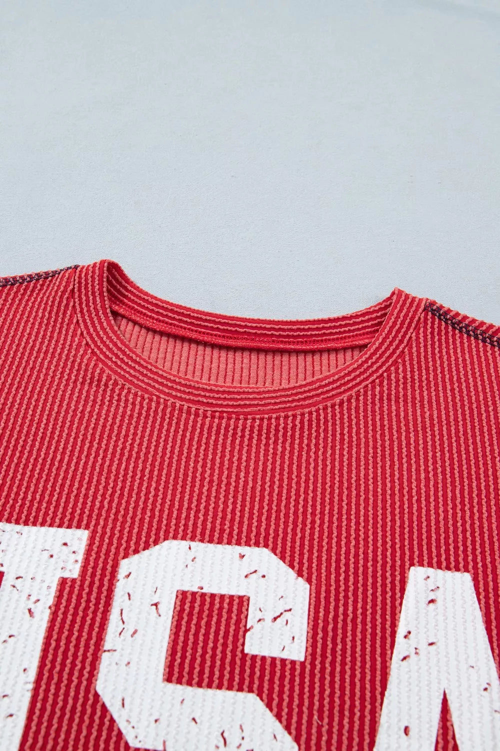 Red twisted rib t-shirt with distressed USA graphic and crew neck.