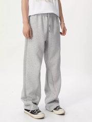 Relaxed fit grey sweatpants with adjustable drawstring waist and wide leg