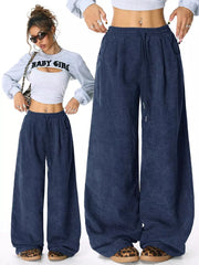 Blue corduroy maternity trousers with wide legs and drawstring waist.