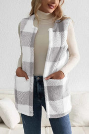 Oversized sherpa gilet in light gray and white buffalo check with pockets.