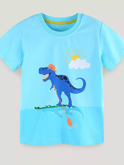 Blue toddler t-shirt with a graphic of a blue dinosaur wearing an orange cap and fishing in water with a crocodile.
