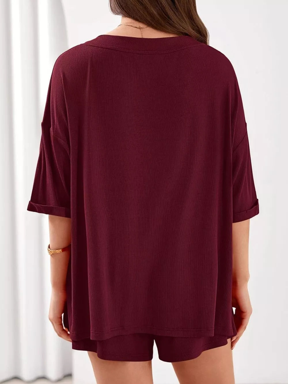 Burgundy ribbed V-neck loungewear set with cuffed short sleeves and matching shorts.