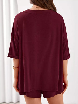 Burgundy ribbed V-neck loungewear set with cuffed short sleeves and matching shorts.