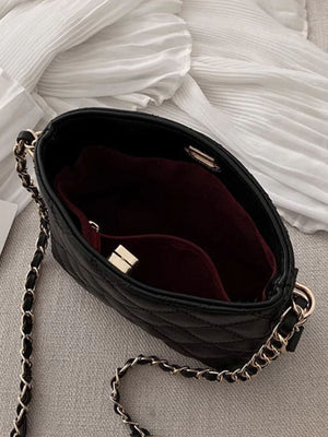 Black quilted pu leather crossbody bag with chain strap and gold hardware detail.