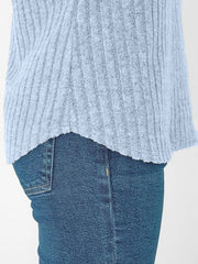 Light blue ribbed V-neck t-shirt with a relaxed fit, shown with jeans.