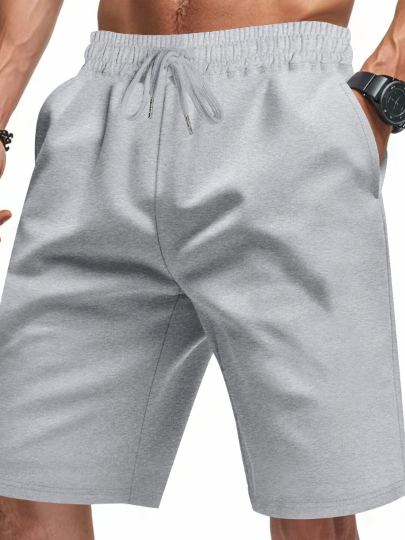 Light gray chino shorts with drawstring waist and pockets, styled casually.