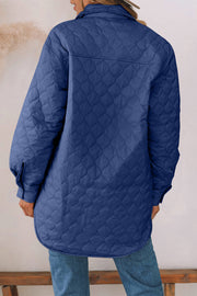 French Blue quilted utility jacket with diamond pattern, collared neckline and button cuffs.