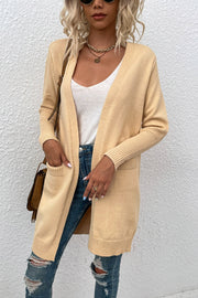 Khaki ribbed cuff open-front cardigan with pockets, styled with a white tank and jeans.