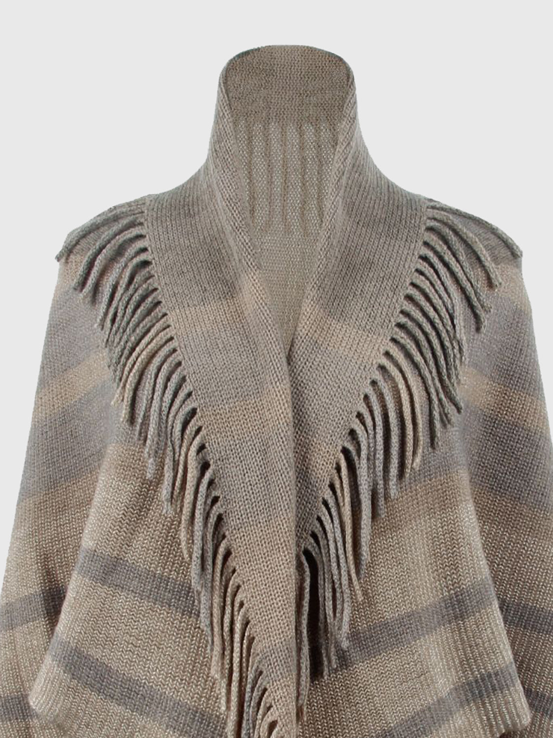 Textured knit capelet in Khaki with fringe detail and striped pattern.