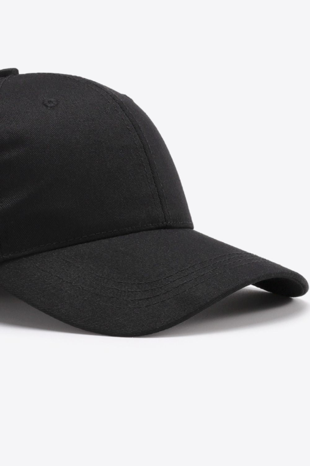Black cotton twill baseball cap with curved brim and stitched details.