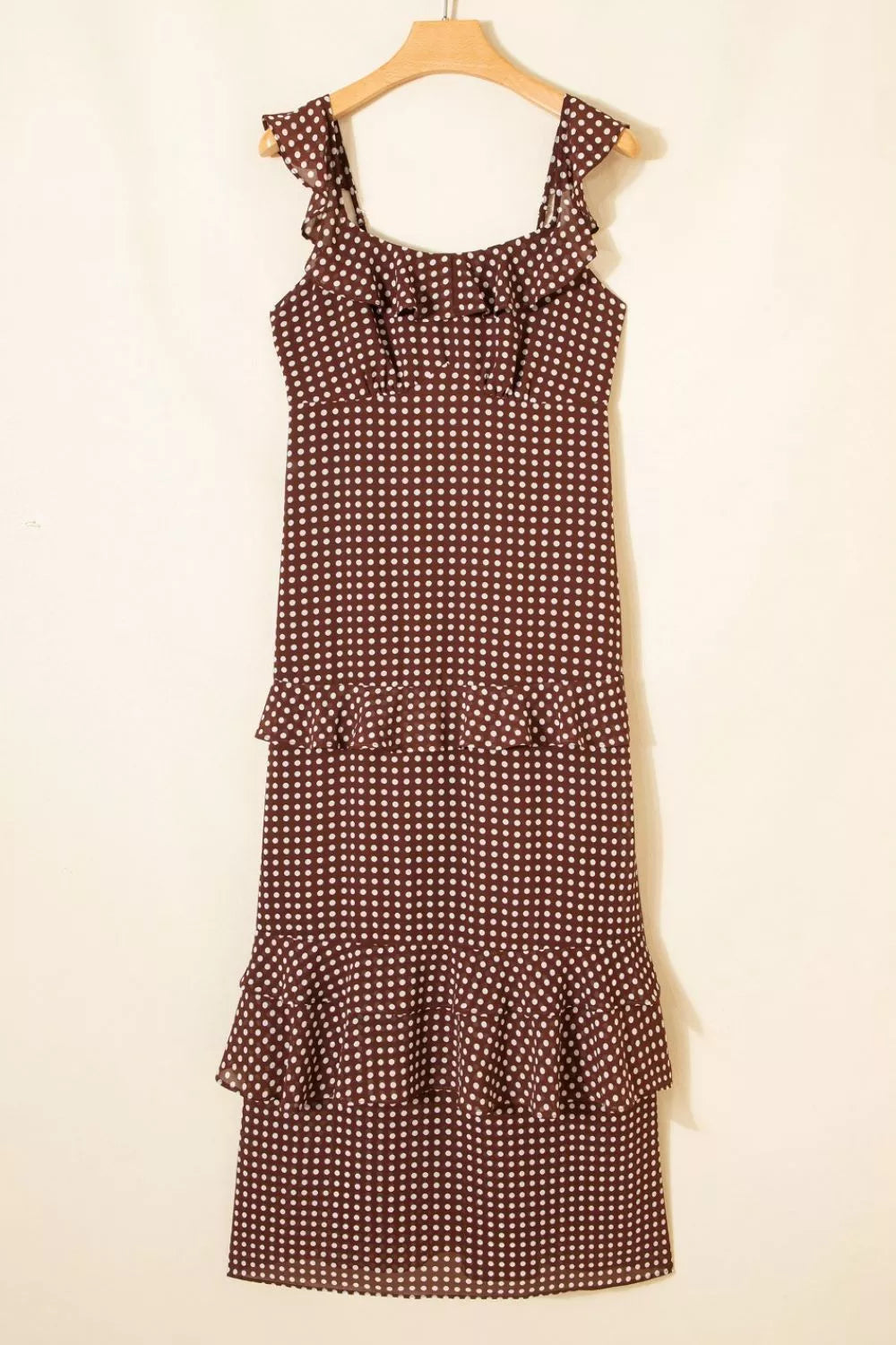 Brown polka dot maxi dress with ruffled neckline and tiered hem