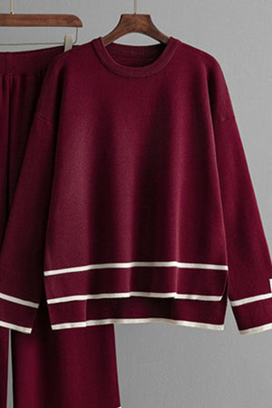 Burgundy acrylic loungewear set with round neck top and striped hem detail