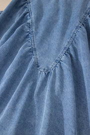 V-shaped pleated denim sleeveless top with a V-neckline detail