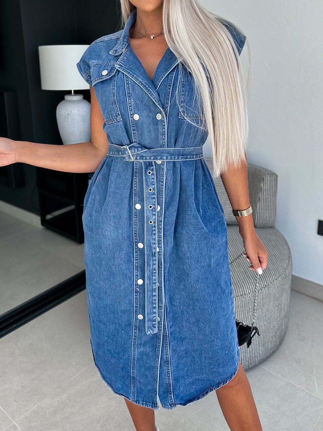 Medium wash denim shirtdress with belt, V-neck, short sleeves, and button front.