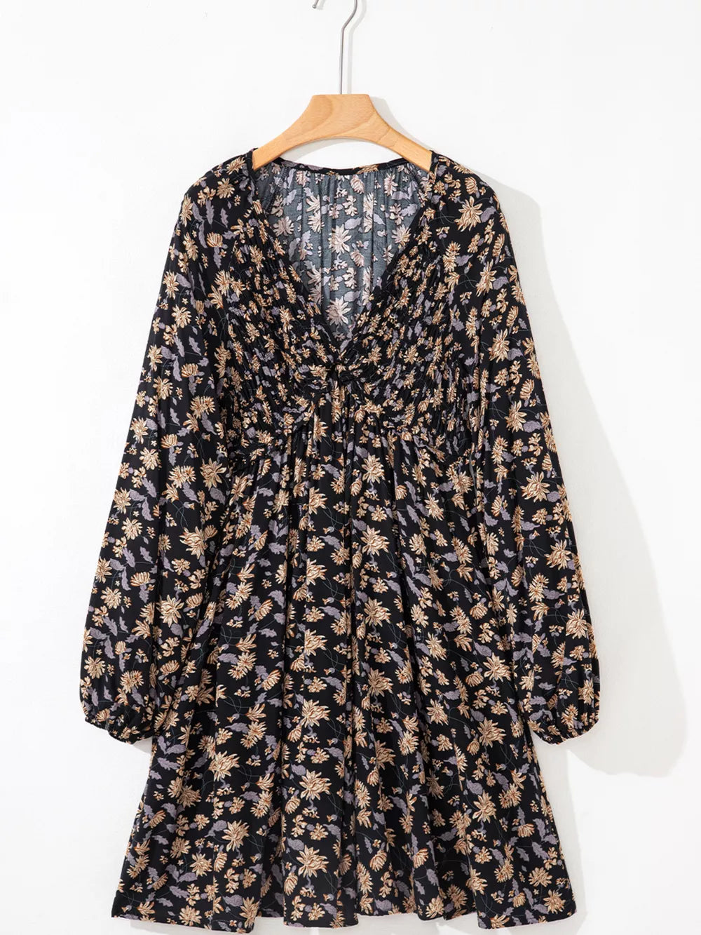 Floral babydoll dress with deep V-neck, bubble sleeves, and dark floral pattern.