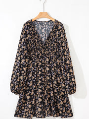 Floral babydoll dress with deep V-neck, bubble sleeves, and dark floral pattern.