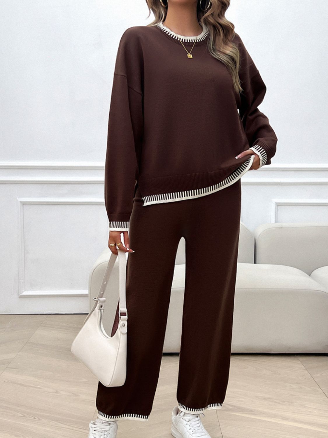 Brown knit loungewear set with white ribbed trim on neckline, cuffs, and hem.