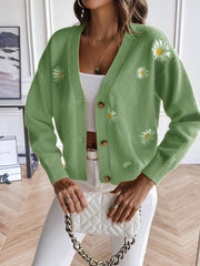 Matcha green button-down cardigan with embroidered daisies and button closure.