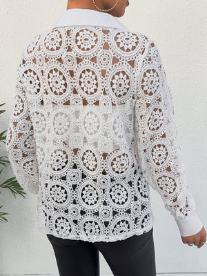 White lace cutout button-up shirt with classic collar and long sleeves.