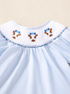 Blue cotton baby smocked set with embroidered cow faces and floral trim