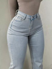 Light blue denim maternity jeans with pockets and a sculpted flare leg.