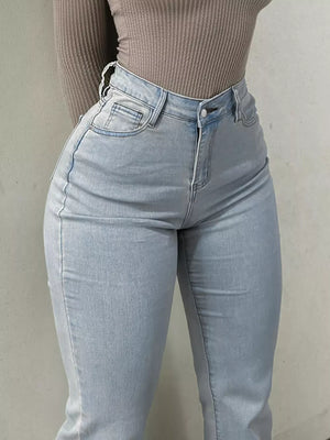 Light blue denim maternity jeans with pockets and a sculpted flare leg.