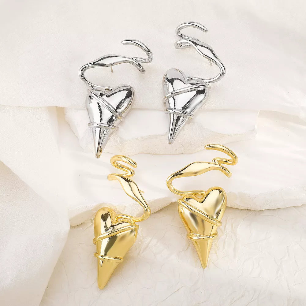 Twisted heart wire earrings in silver and gold luxe finish with unique spiral detail.