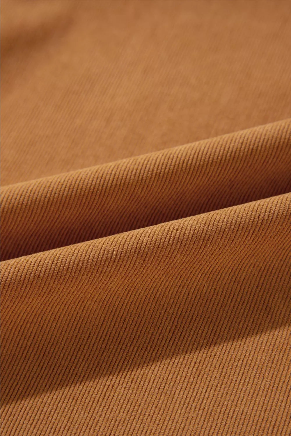 Caramel corduroy fabric detail of a puff sleeve mini dress
