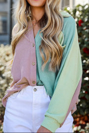 Waffle knit colorblock button-up shirt in dusty pink and mint green with a collared neckline.